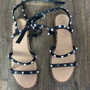 Black studded target sandals